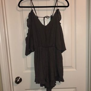 grey romper with ruffles, flowy sleeves, tie back